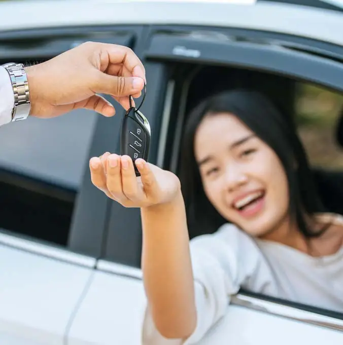 Car owner receiving keys after selling vehicle in Queensland
